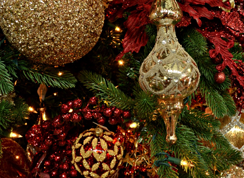 Festive Tree with Warm Browns, Reds, and Golds adorned with Feathers