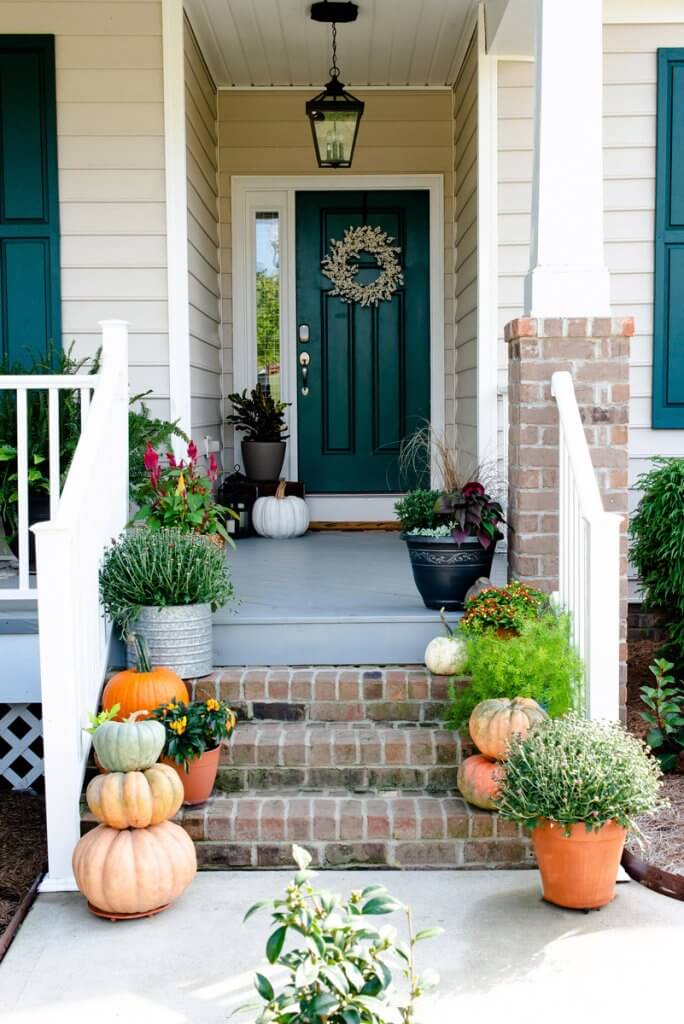 pumpkins and plants on front steps