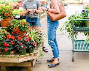 Two people talking in the garden shop