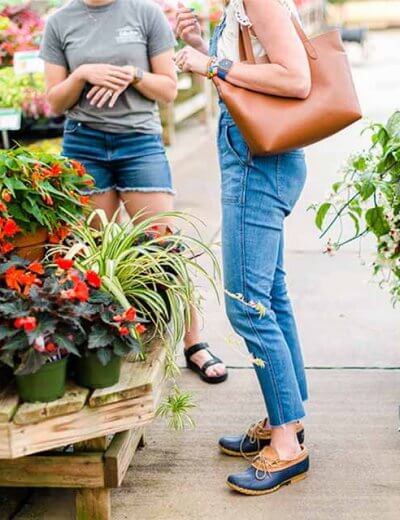 Two people talking in the garden shop